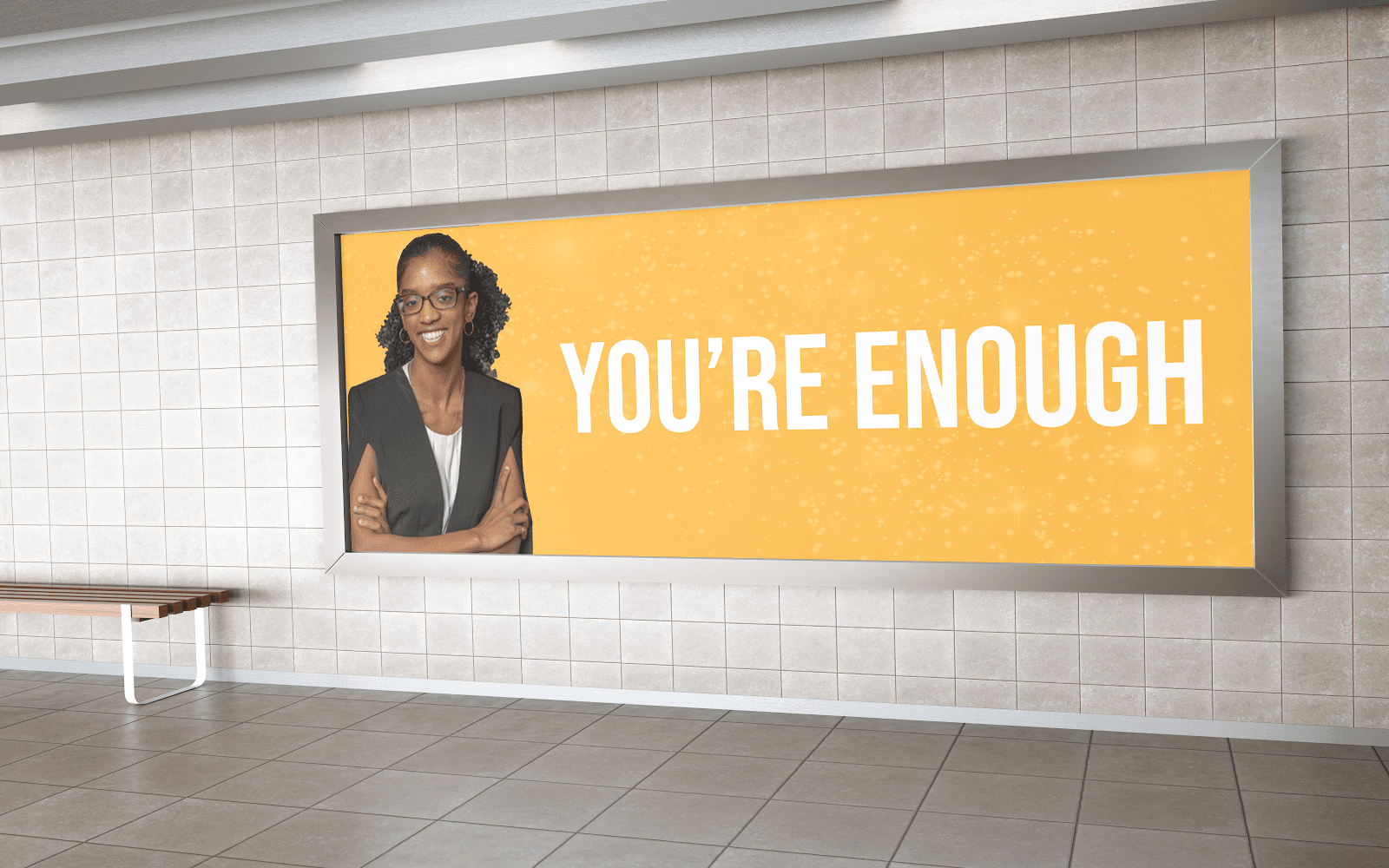 A billboard with a photo of Janelle and the quote "You're enough."